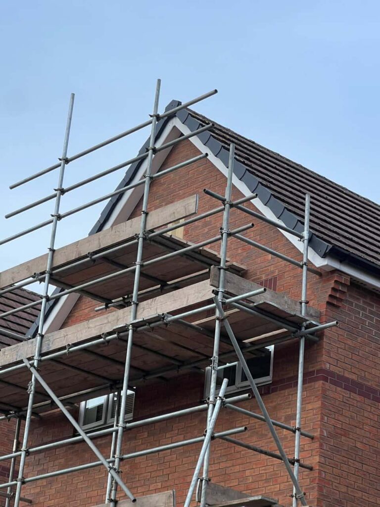 This is a photo of a roof which has just been repaired. There is a scaffold located at the gable end for access onto the roof. Works carried out by North Hykeham Roofing Repairs